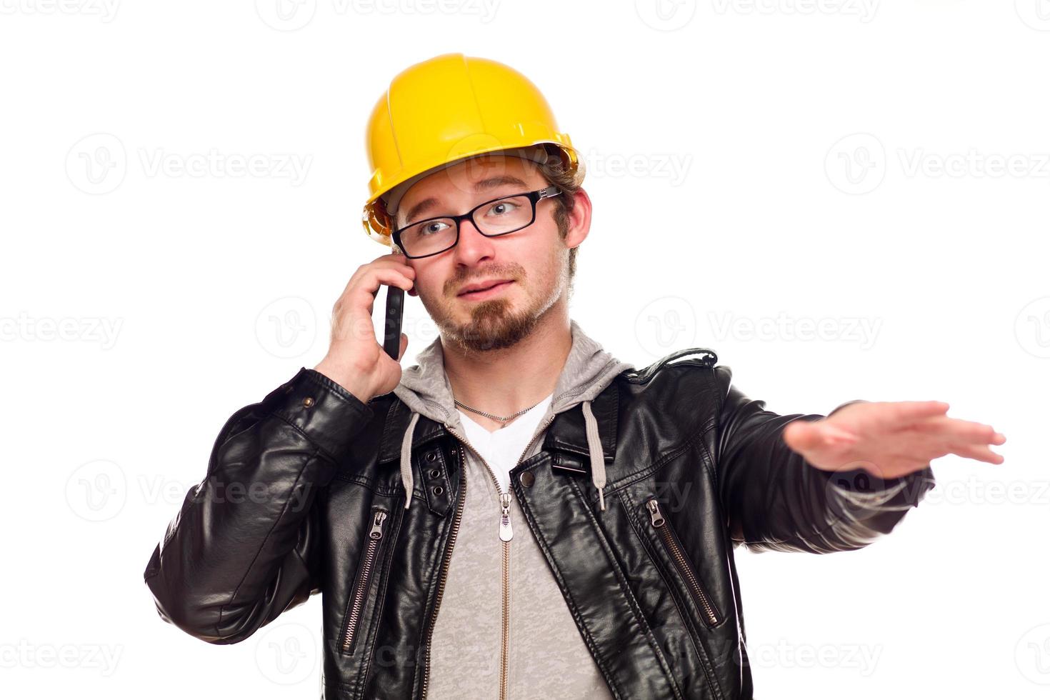 Handsome Young Man in Hard Hat on Phone photo