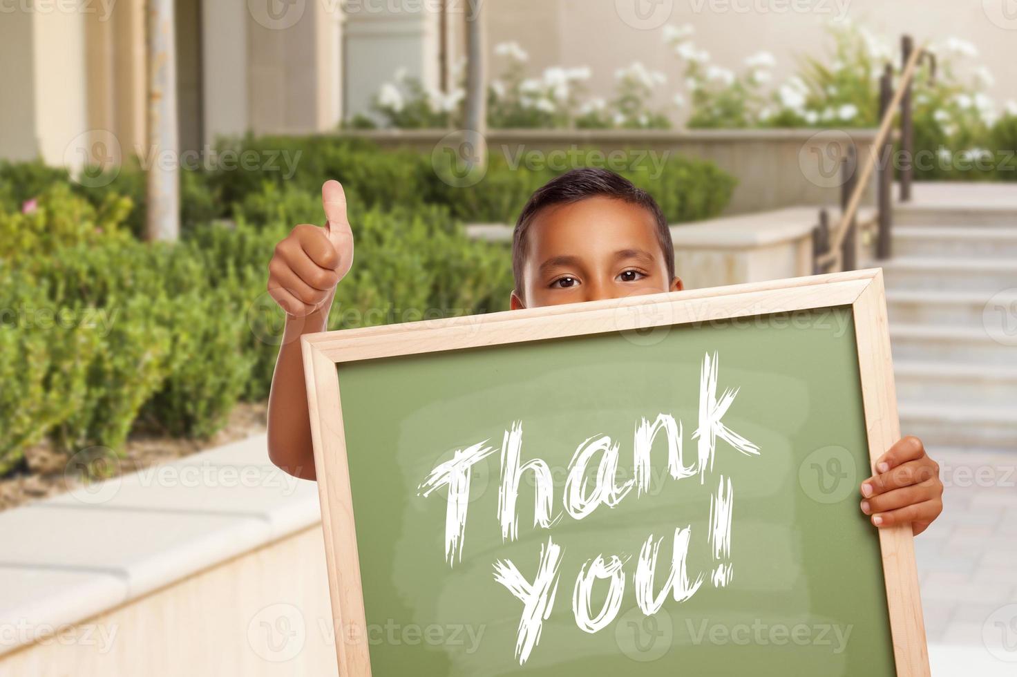 Boy Giving Thumbs Up Holding Thank You Chalk Board photo