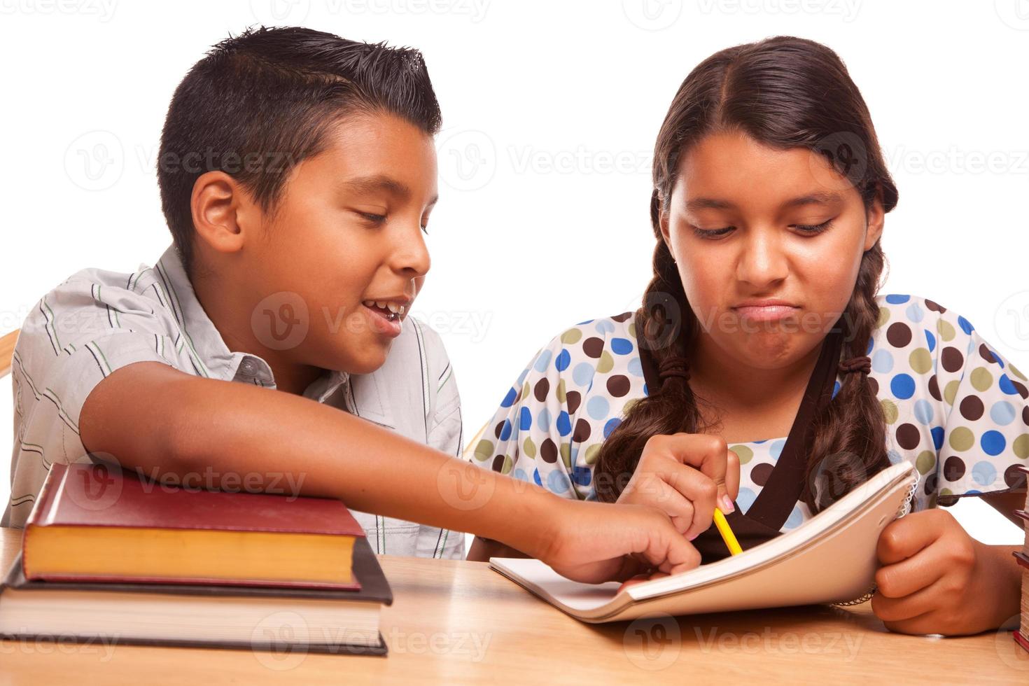 Hispanic Brother and Sister Having Fun Studying photo