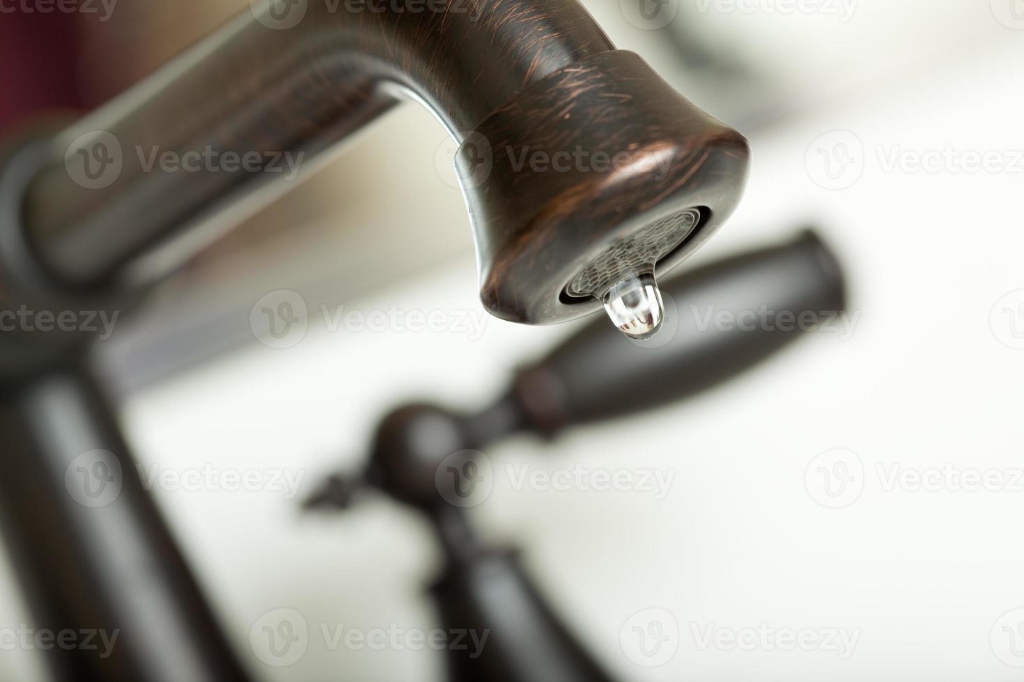 Water Dripping from Water Faucet photo