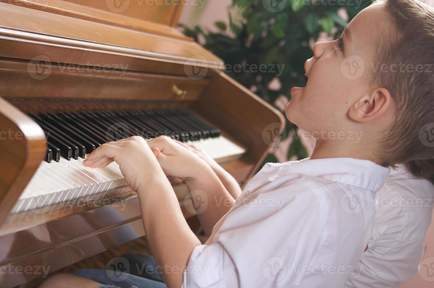 Children Playing the Piano photo