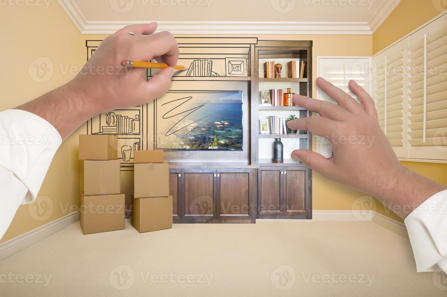 Hands Drawing Entertainment Unit In Room With Moving Boxes photo