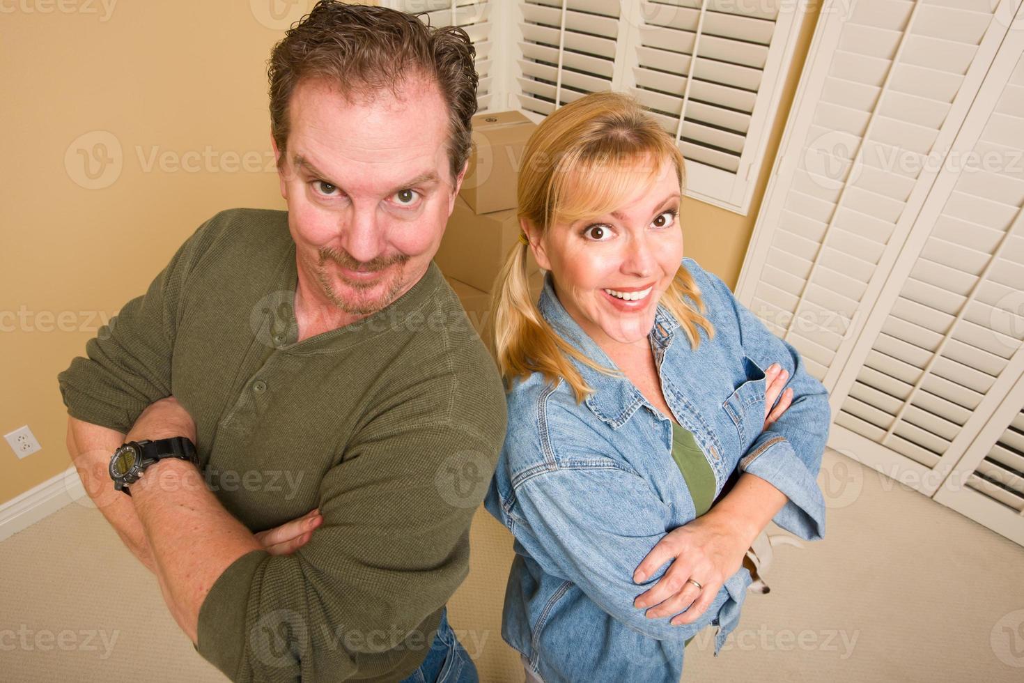 Goofy Couple and Moving Boxes in Empty Room photo