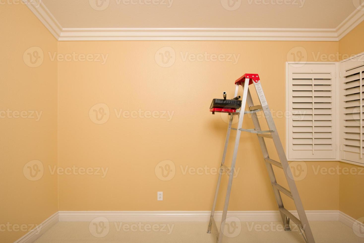 Empty Room with Ladder, Paint Tray and Rollers photo