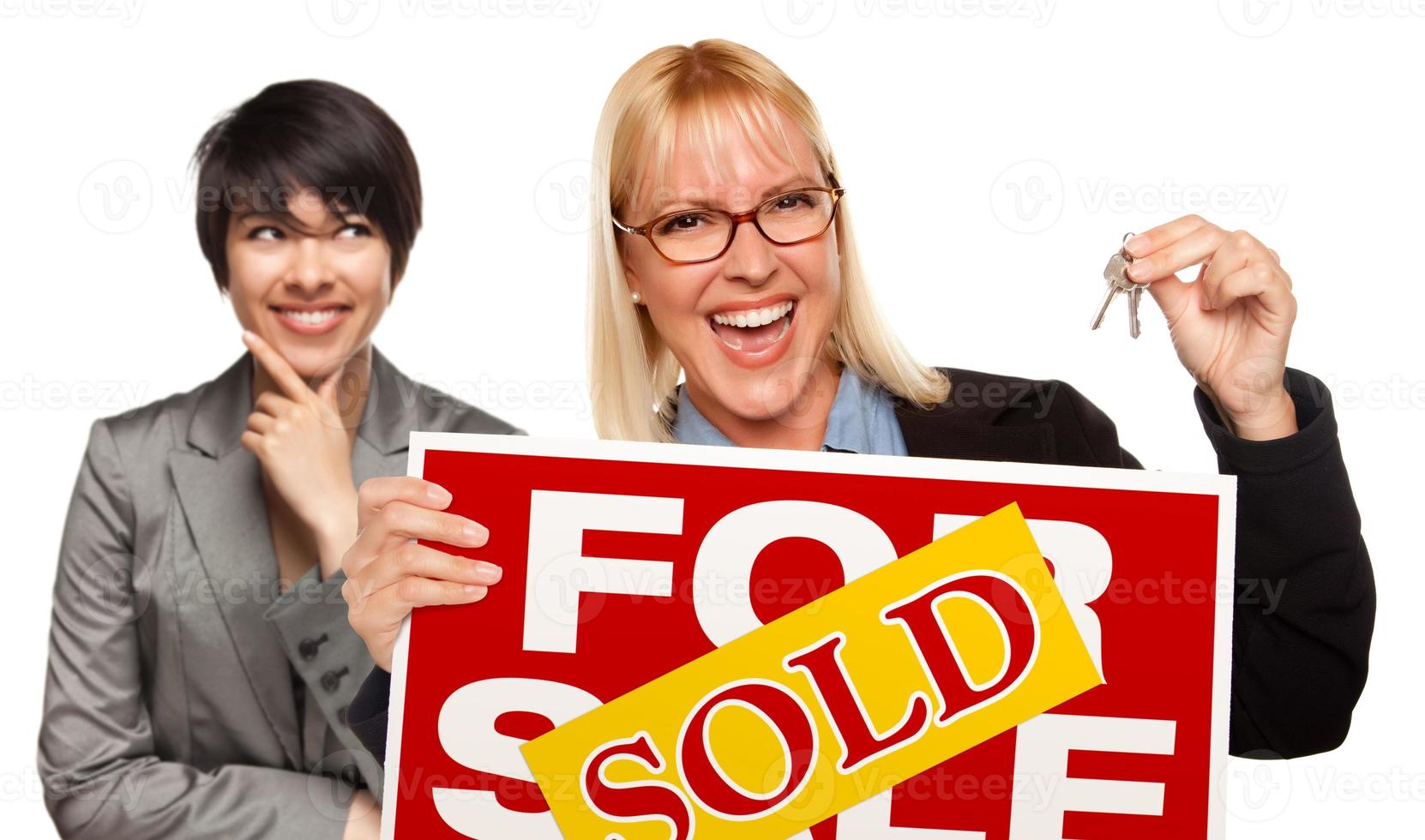 Female with Blonde Woman Holding Keys and Sold For Sale Sign photo