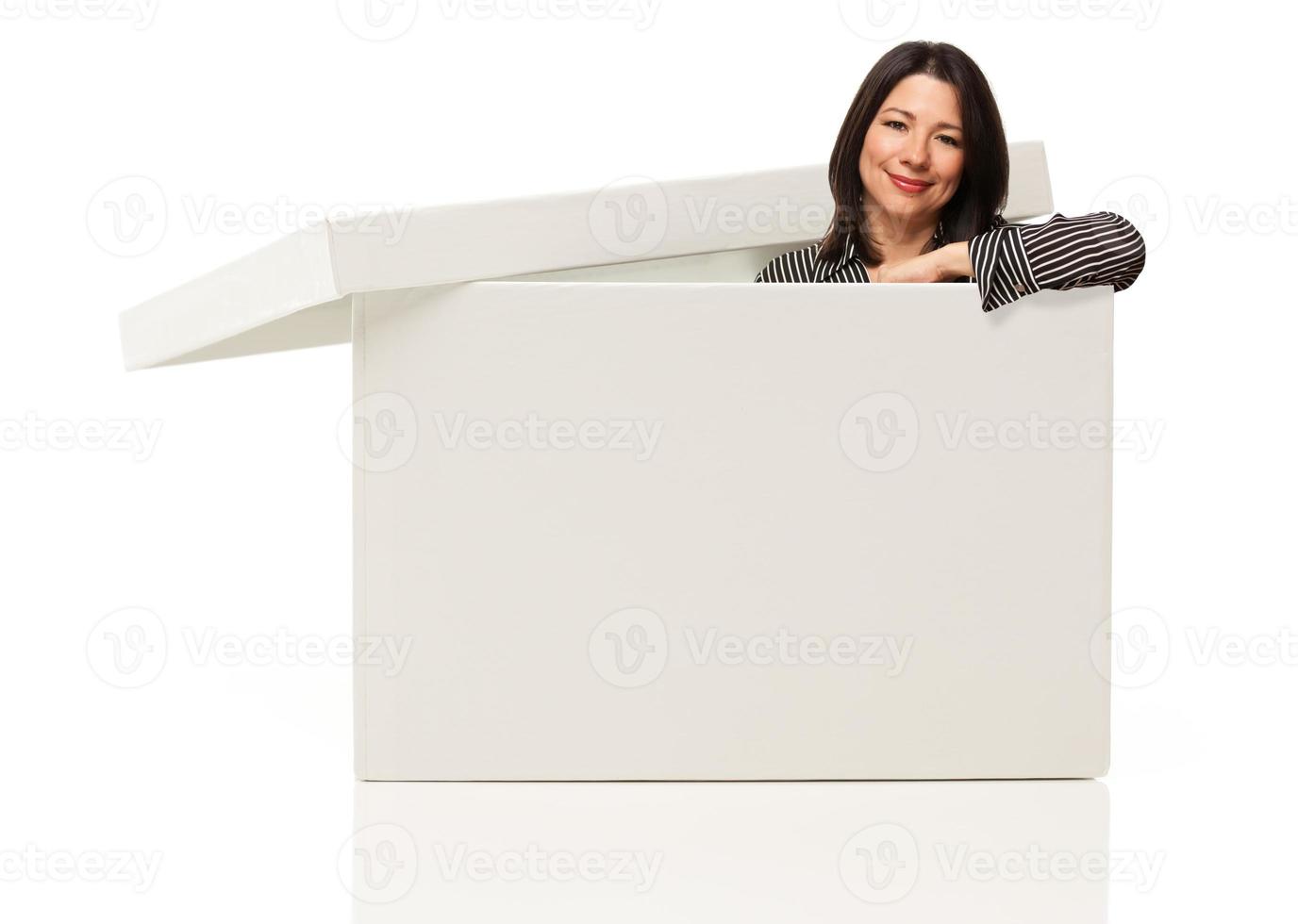 Multiethnic Woman Standing Inside Blank White Box photo