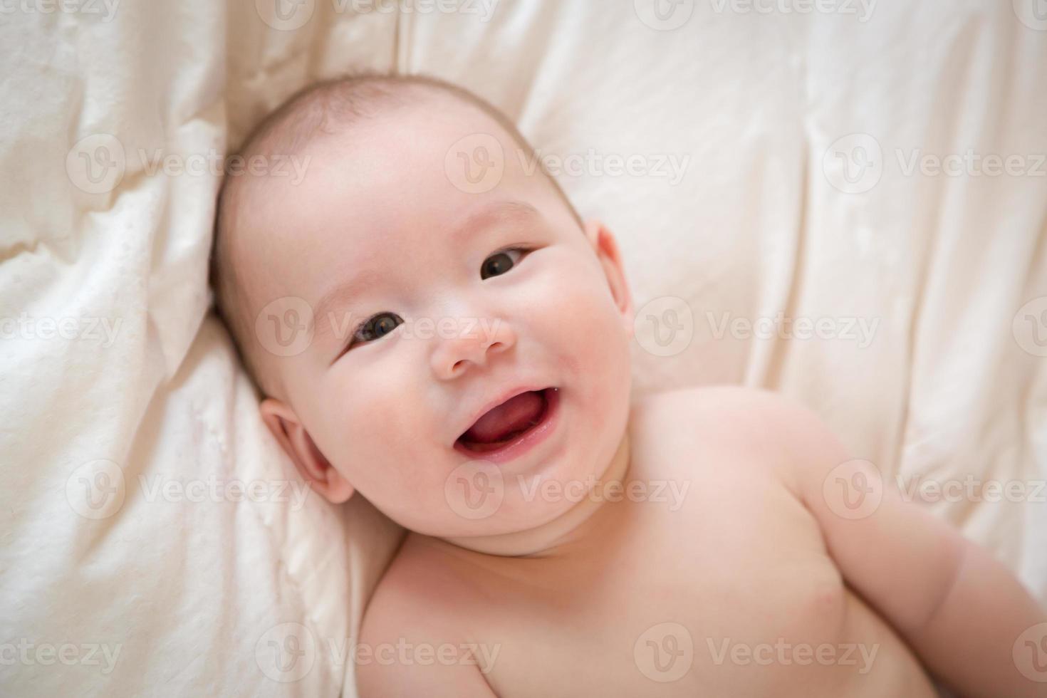 Mixed Race Baby Boy Having Fun on His Blanket photo