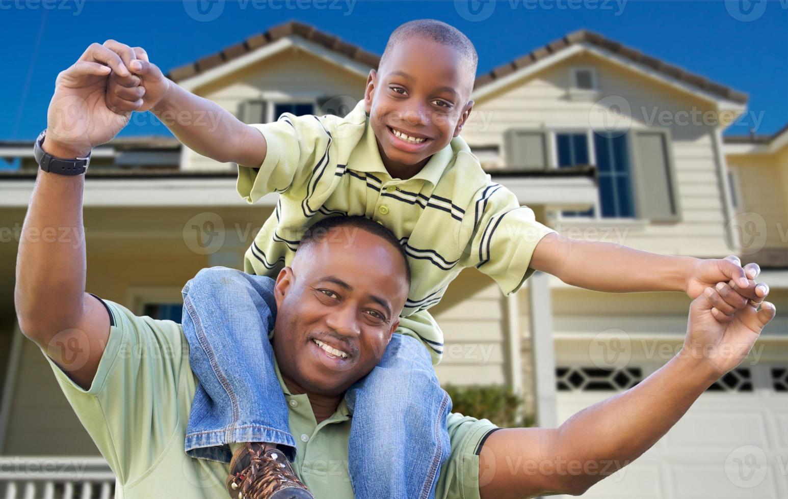 Playful Father and Son In Front of Home photo