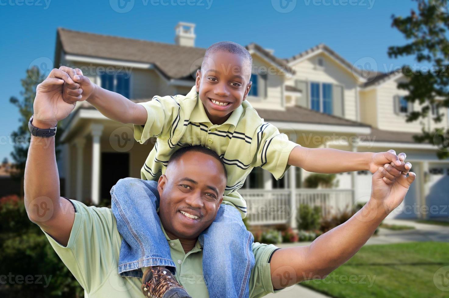 Playful Father and Son In Front of Home photo
