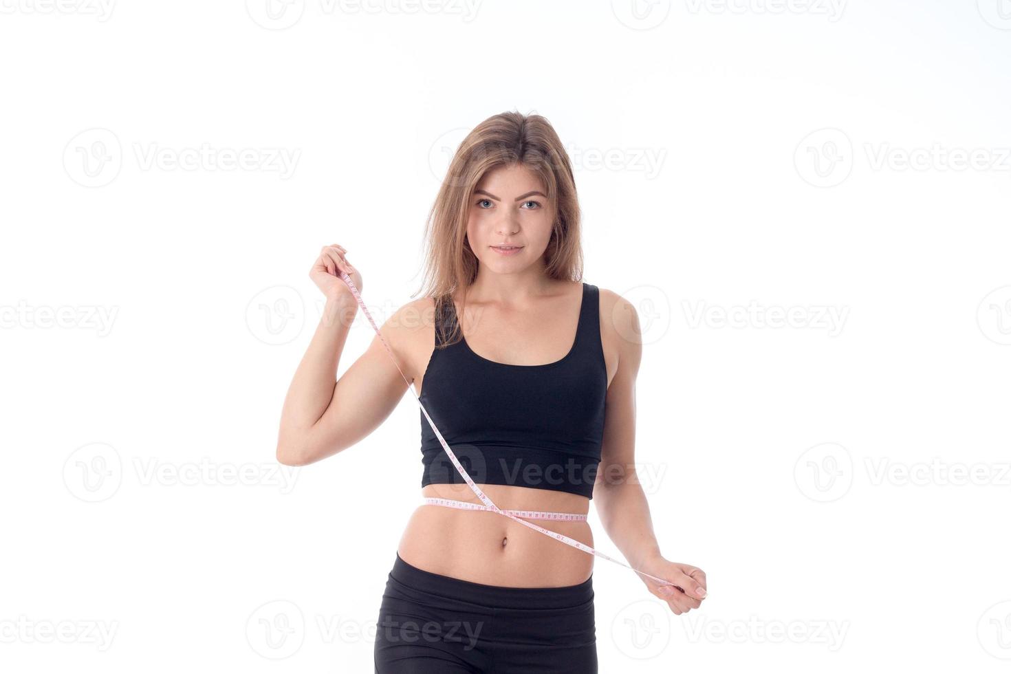 young athletic girl standing with her hair straight photo