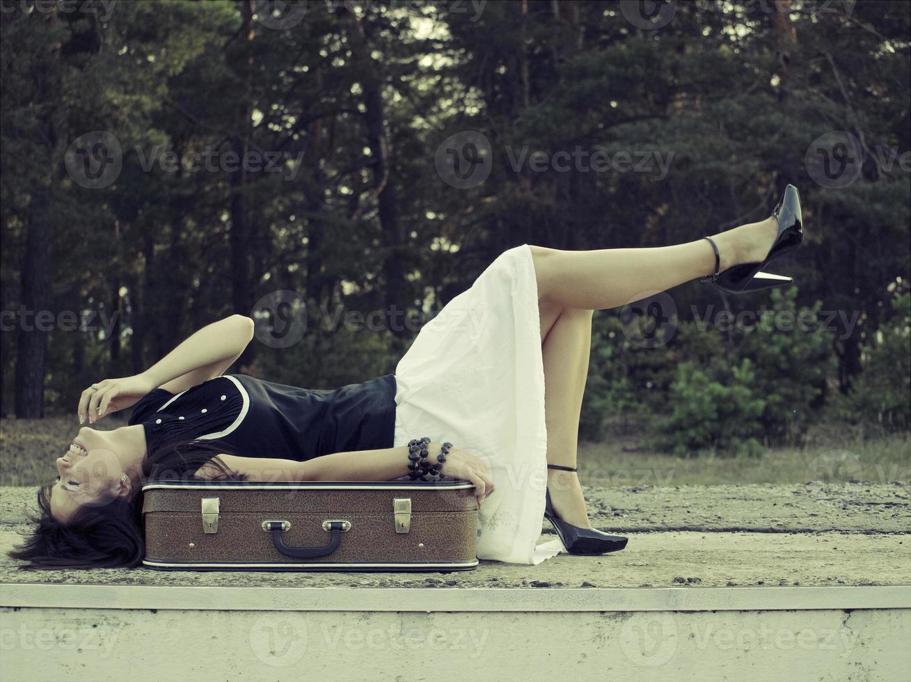 Woman with suitcase photo