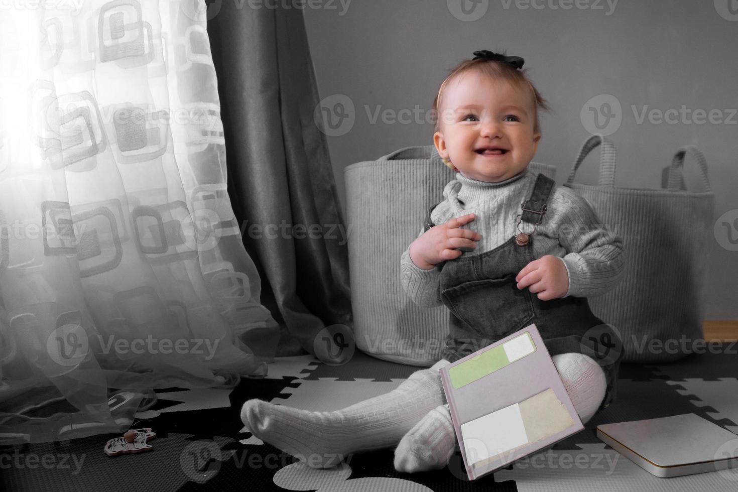 Cutie little baby girl smiles at home photo