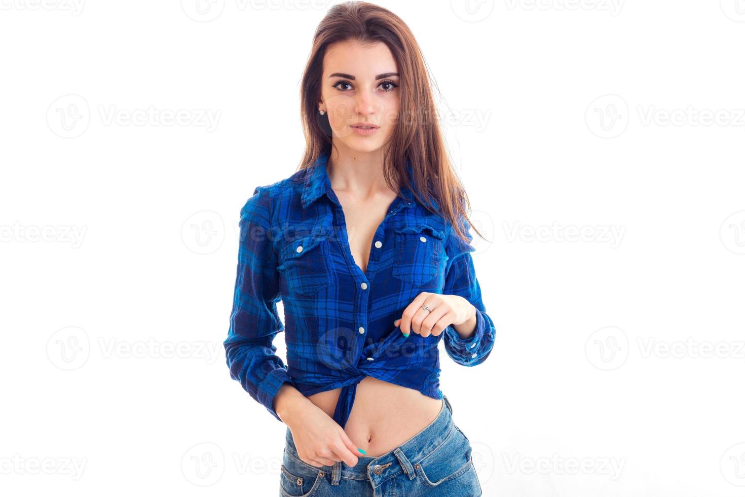 beautiful young girl in a blue Plaid Shirt posing on camera photo