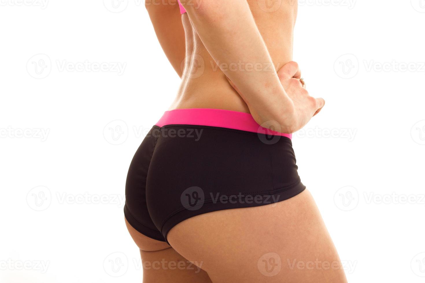 beautiful buttocks of a young girl in shorts close-up photo