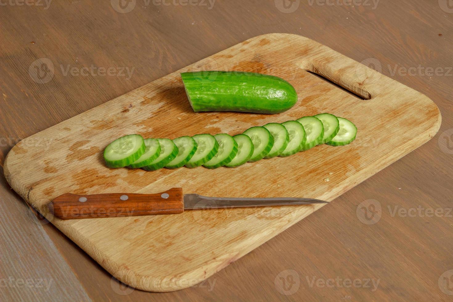 cucumber slices on a cutting board photo