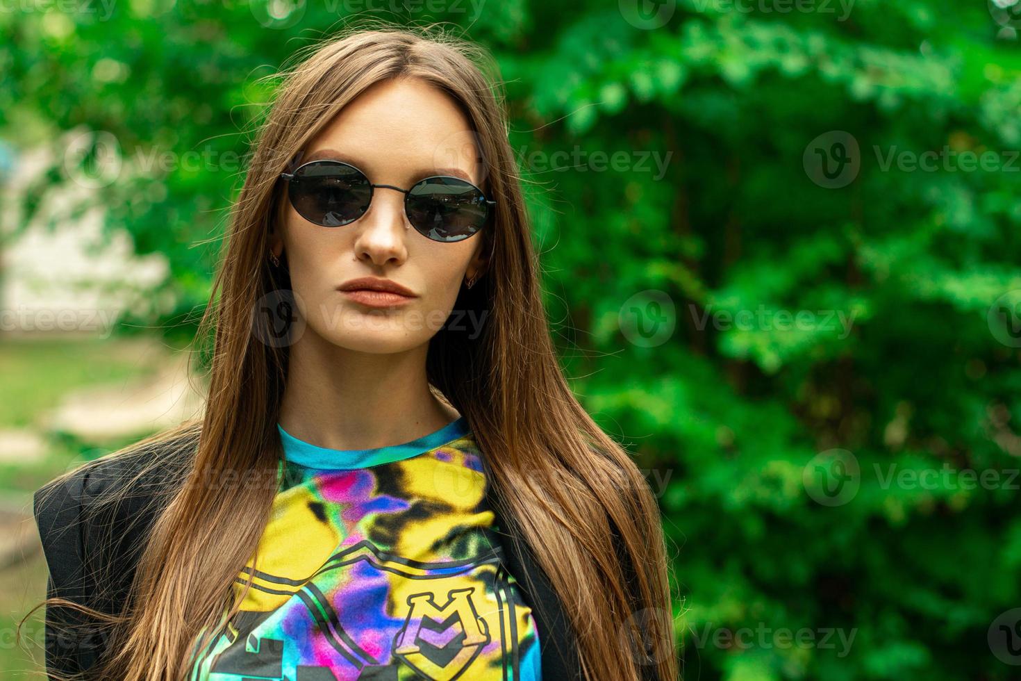 portrait of stylish young girl outdoos photo