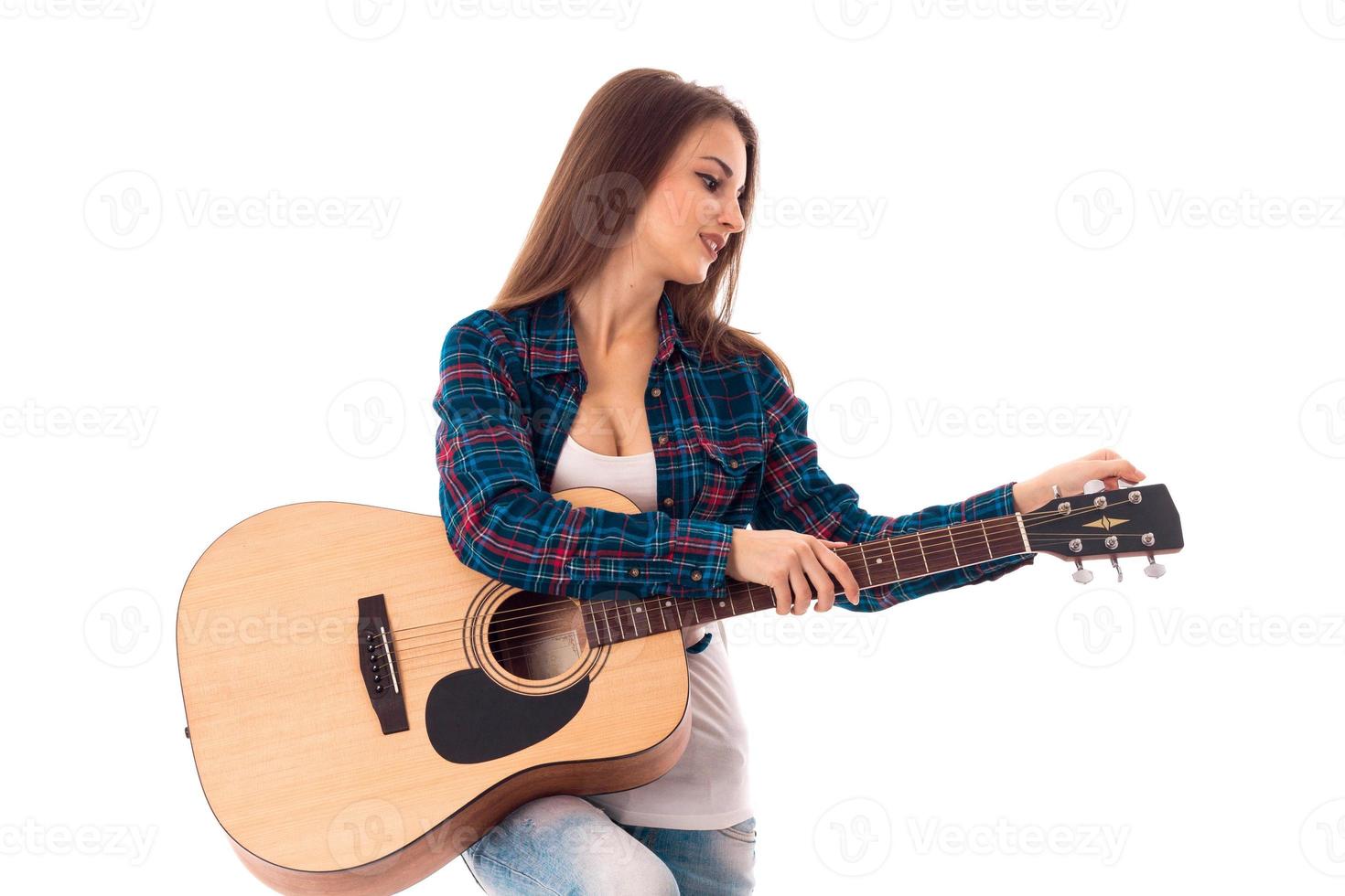 sexy young woman with guitar photo