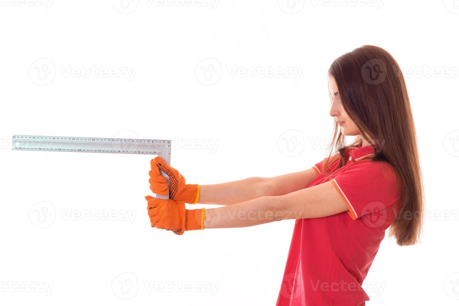 profile portrait of beauty brunette lady builder makes renovation isolated on white background photo