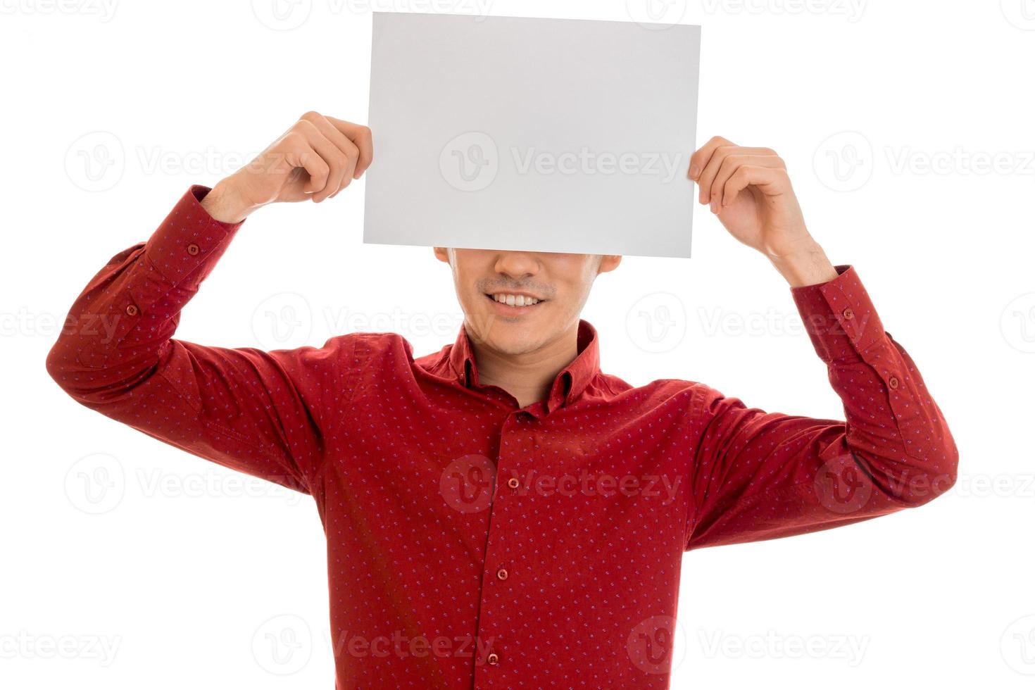 funny male model in red shirt posing with empty placard isolated on white background photo