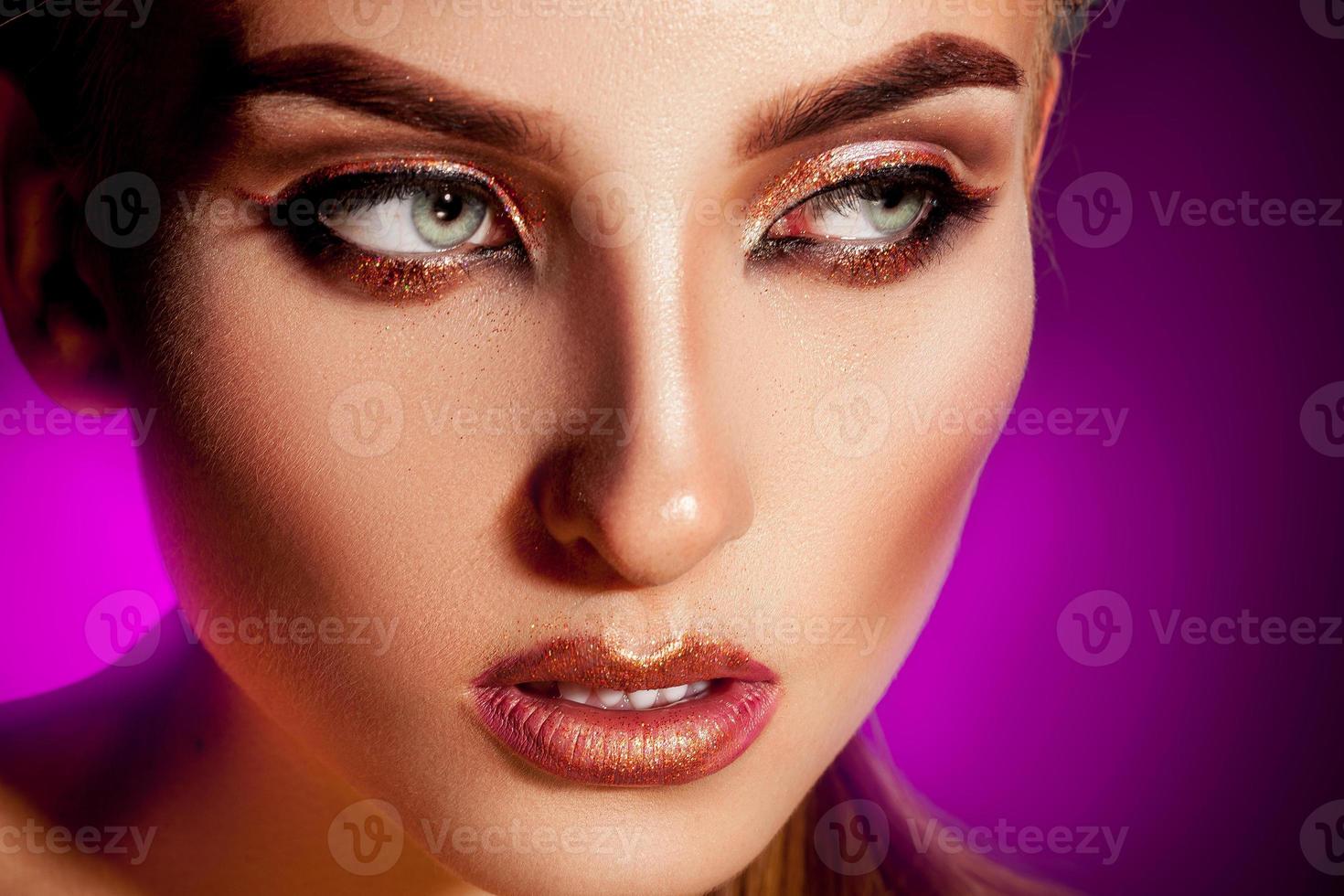 Close up portrait of sexy woman with healthy skin and nice makeup looking away photo