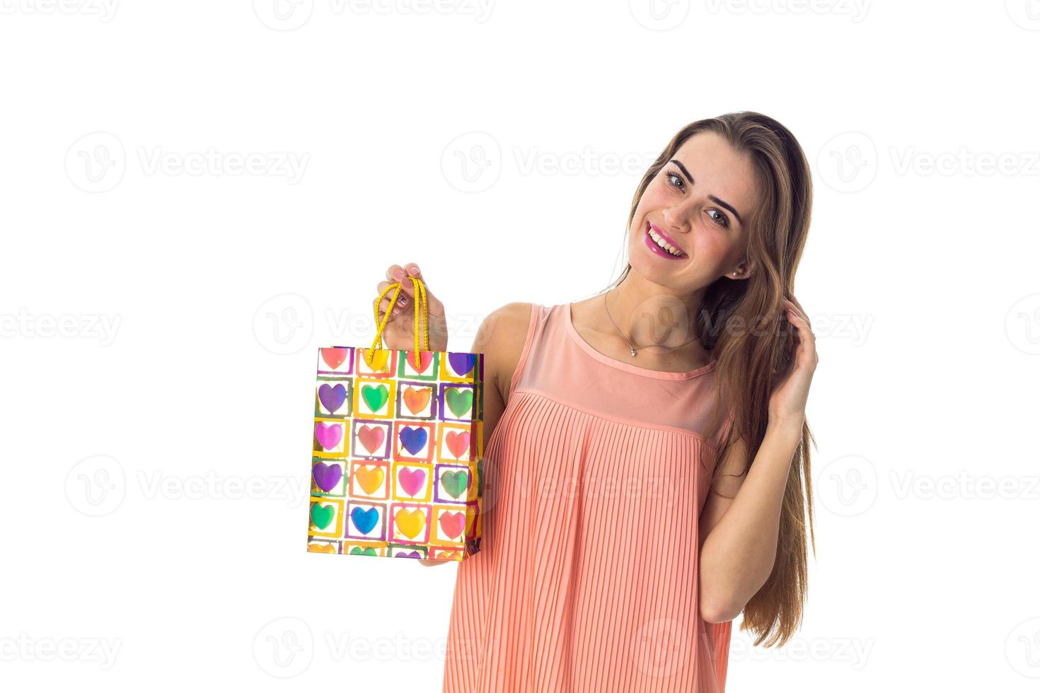 Young woman holding a shopping bag photo