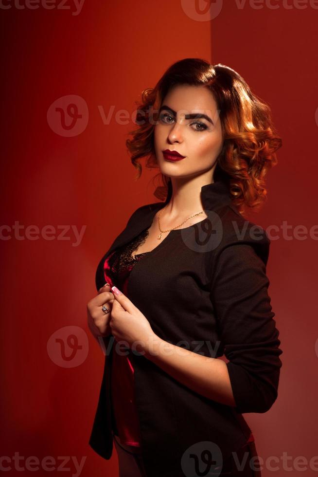 Gorgeous young lady with red lips and beautiful hairstyle photo