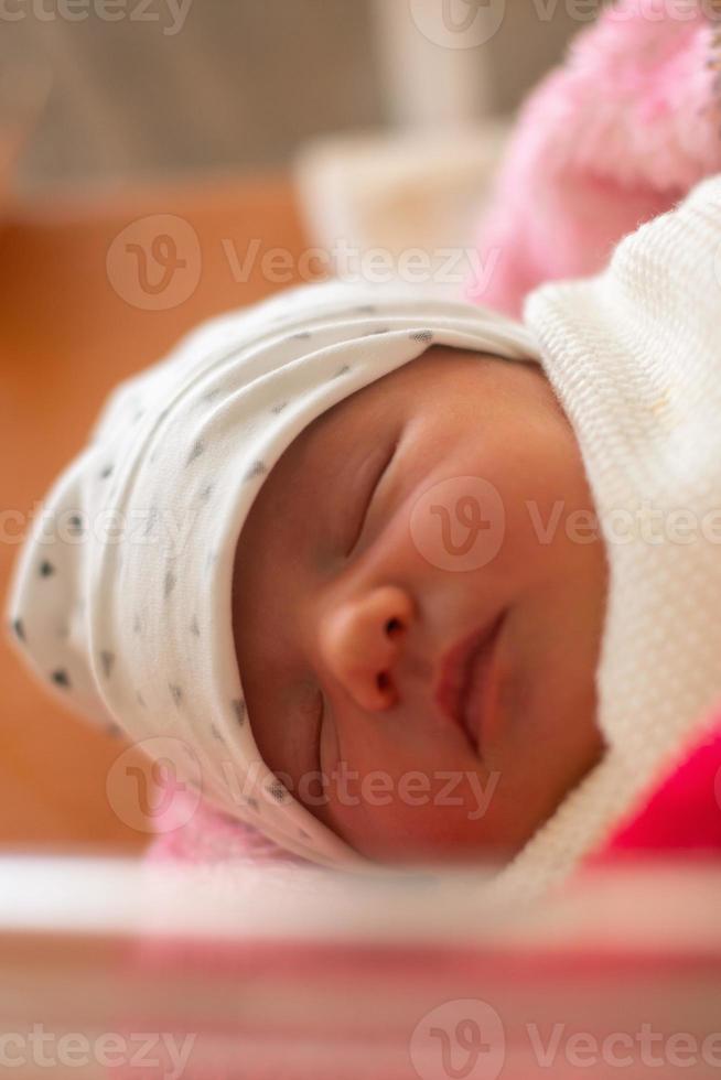 Portrait of a cute newborn girl photo
