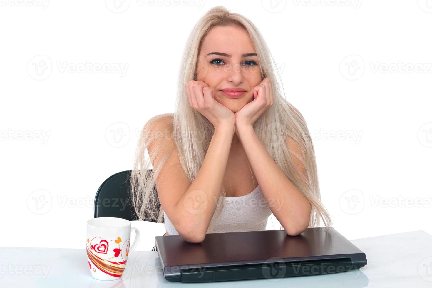 Girl with a cup and laptop photo