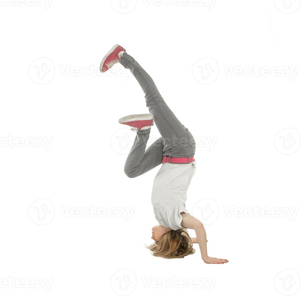 woman in casual clothes standing on her head photo