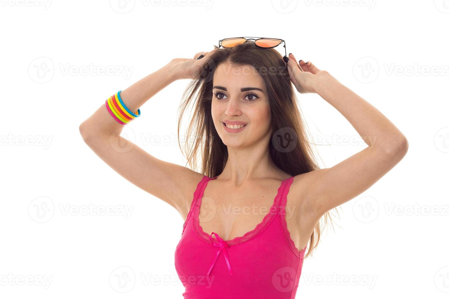 beauty young girl in pink light shirt looking away and smiling isolated on white background photo