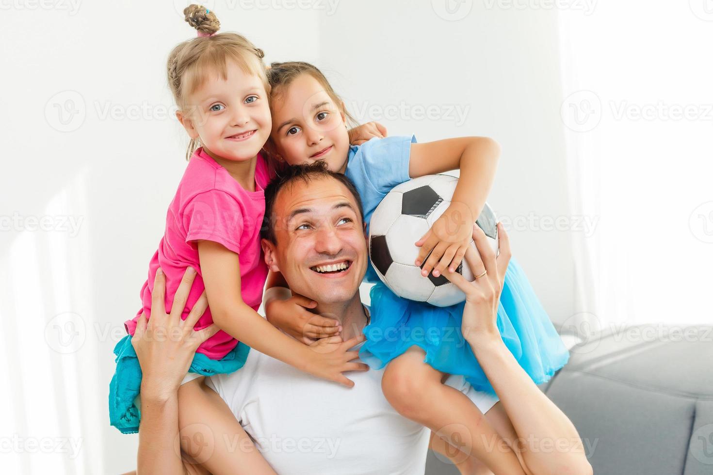 little girls with soccer ball at home photo