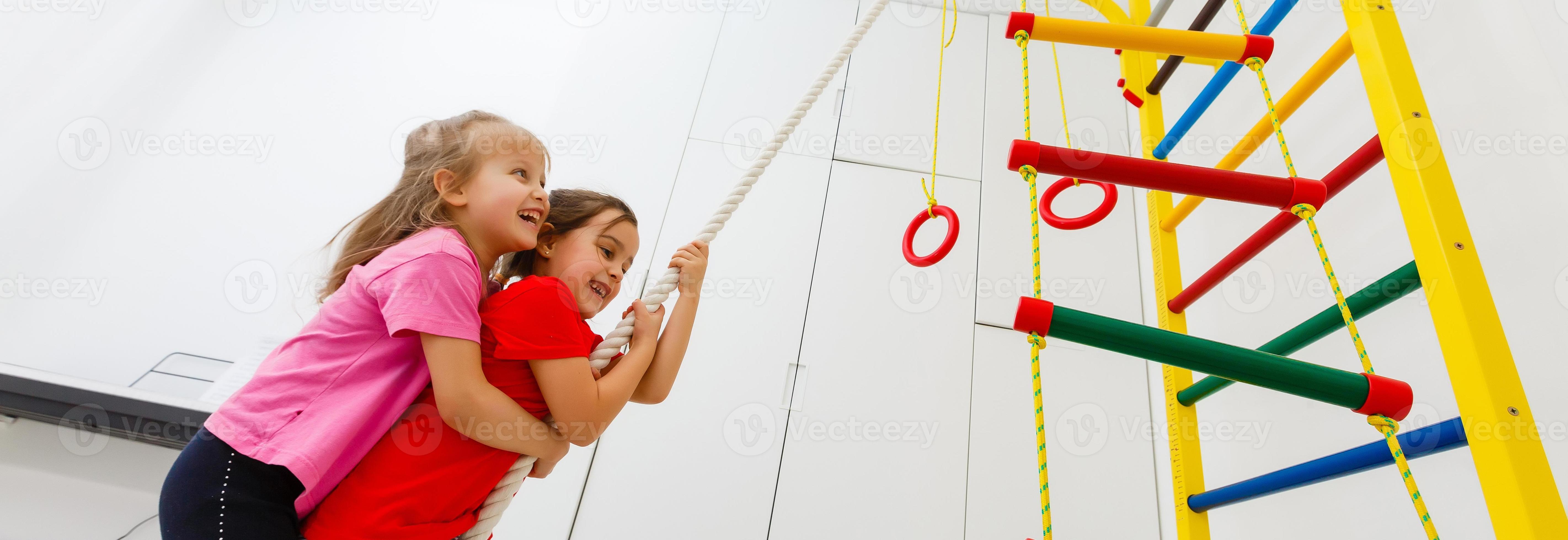 Shot of an attractive female crossfit athlete climbing a rope at the gym.  Beautiful girl rope climbing at the crossfit box motivation positivity  health concentration agility active living Battle rope 16476405 Stock Photo  at Vecteezy