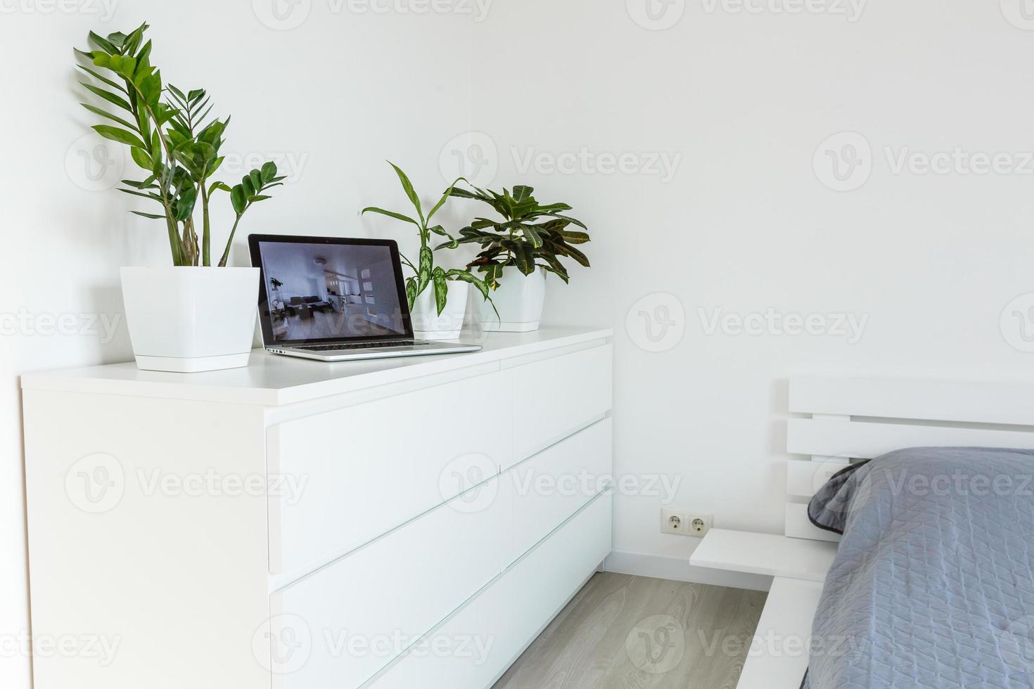 office tabletop with tablet, laptop showing cool hotel responsive design website photo