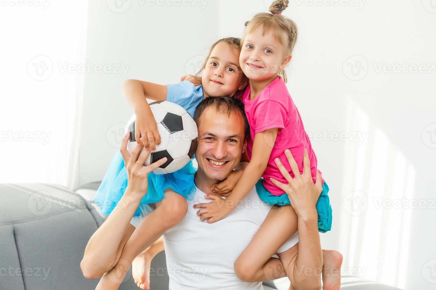 little girls with soccer ball at home photo