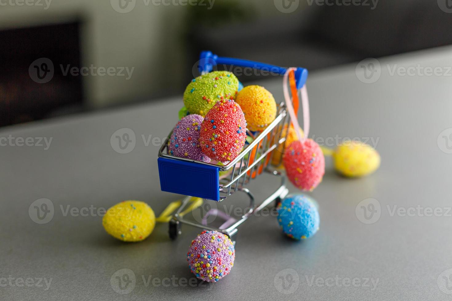 shopping cart with easter eggs for hunting or give away photo
