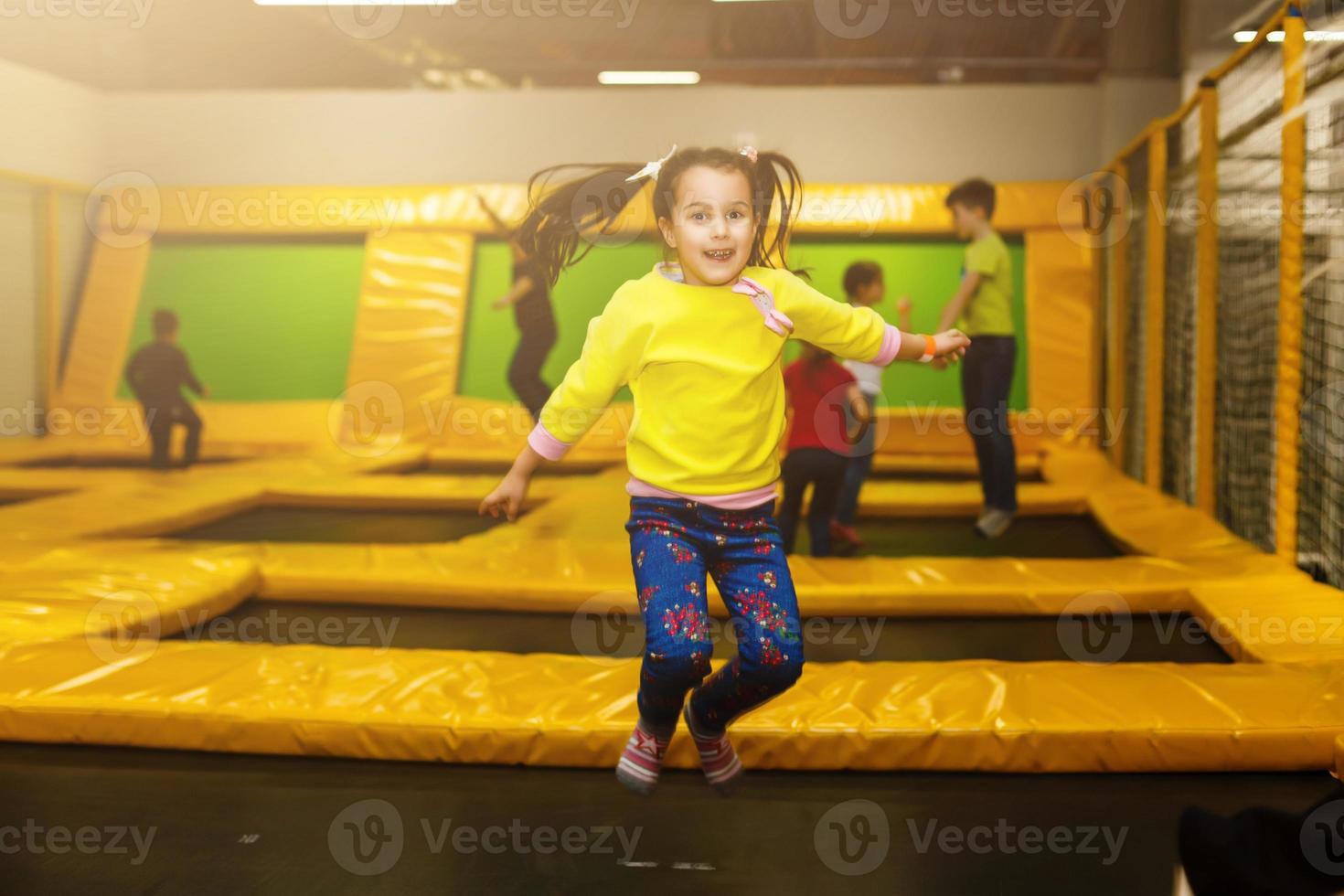 Children playing on a inflatable trampoline photo