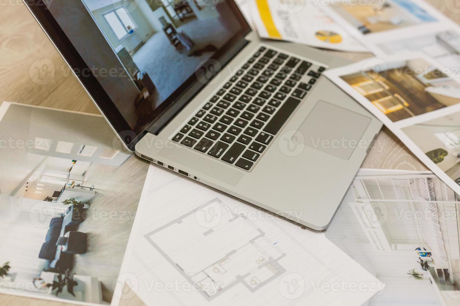 Construction equipment. Repair work. Drawings for building Architectural project, blueprint rolls and laptop tablet pancil and divider compass on table. Engineering tools concept. Copy space. photo