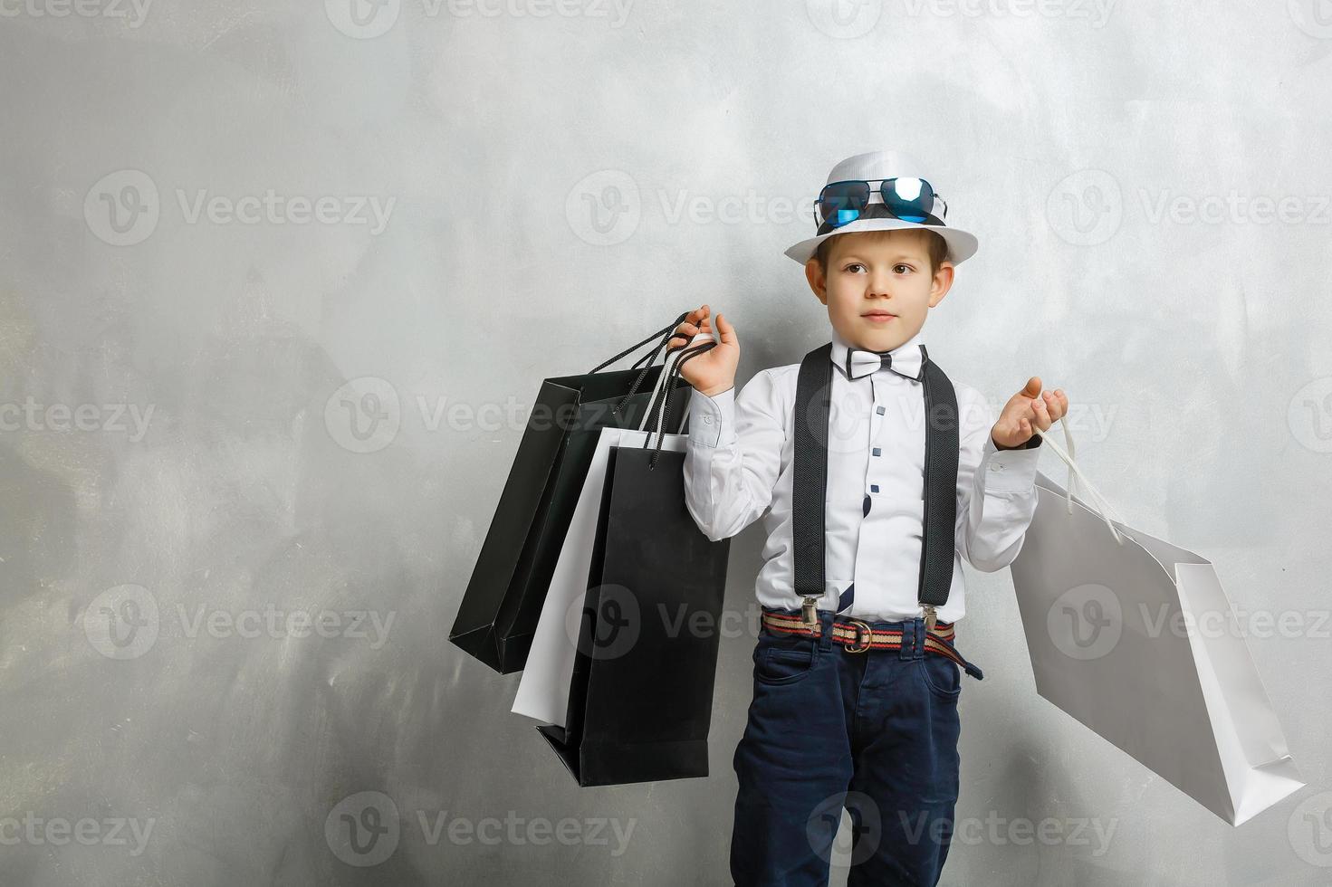 Happy boy with shopping bags photo