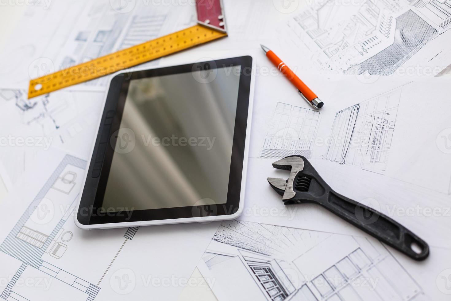 Computer Tablet with Master Bathroom Design Over House Plans, Pencil and Compass photo