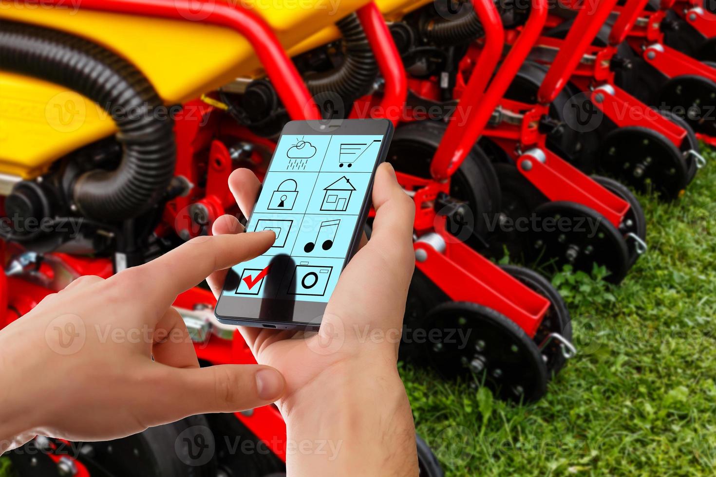 Industrial engineer manager using phone control automation robot machine in intelligent on monitoring. Welding robotics and digital manufacturing operation. Industry photo