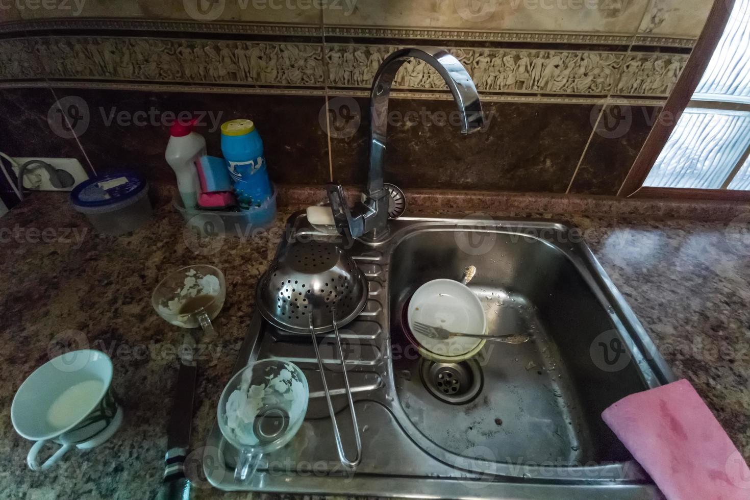 huge heap of dirty dishes waiting for the flatmate photo