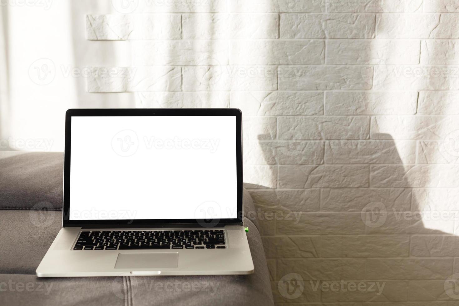The laptop and computer in the morning on a white pillow bed. Lifestyle Concept photo