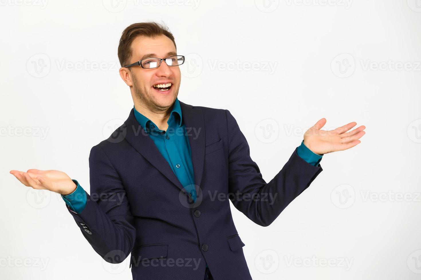 A view of a shocked young businessman isolated on white background photo