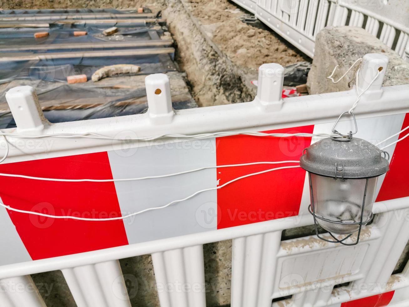 plastic road fencing on the street of a modern city photo