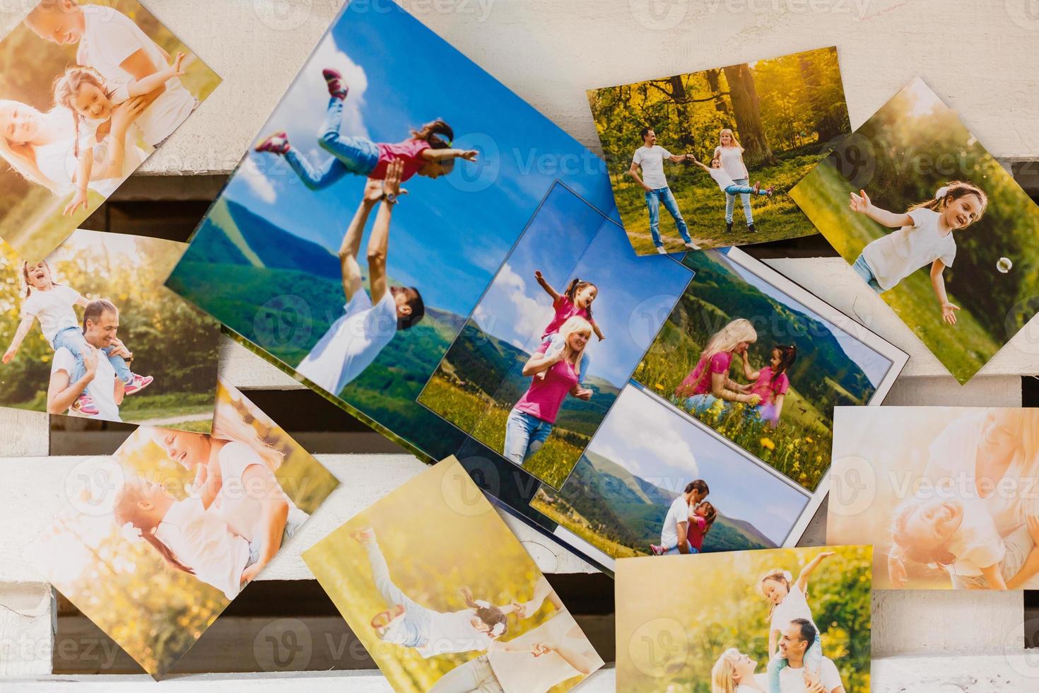 Frame with old paper and photos. Objects over wooden planks photo