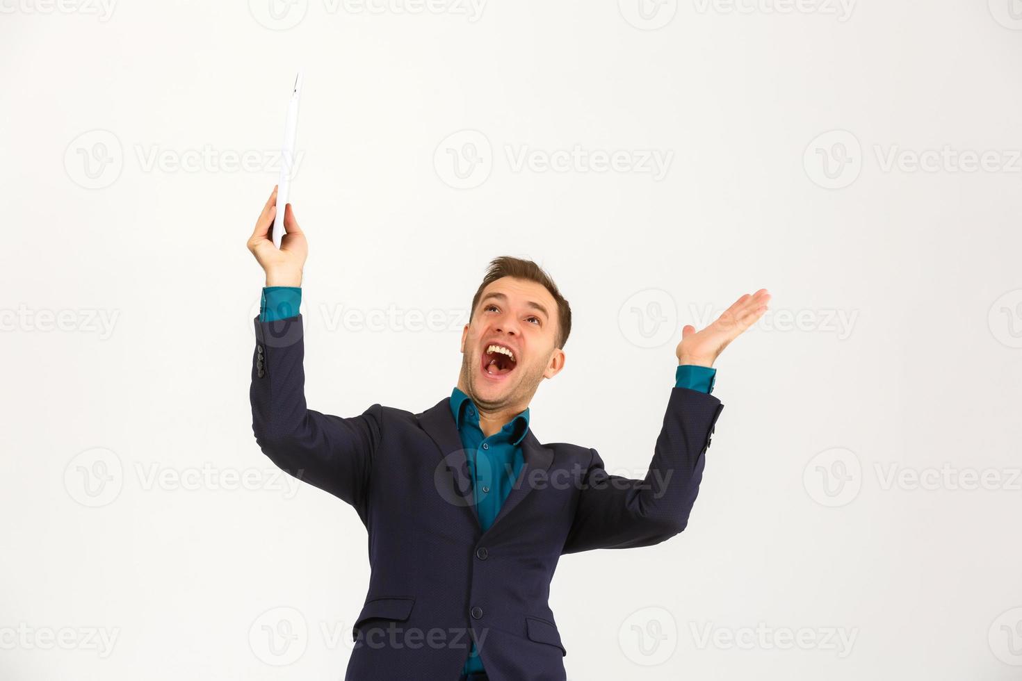 A view of a shocked young businessman isolated on white background photo