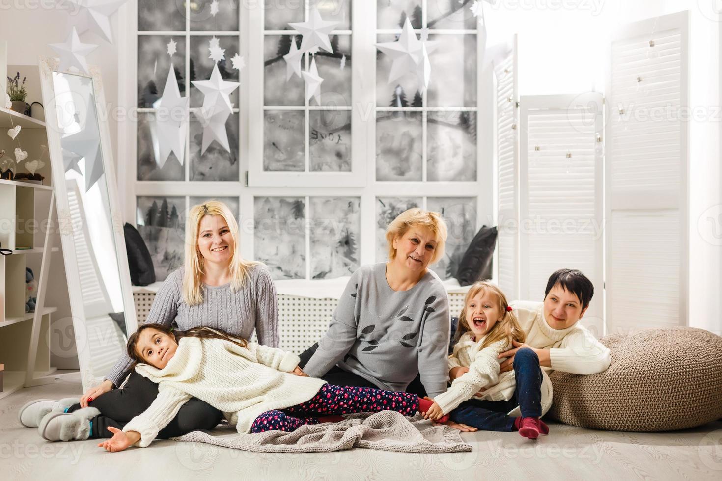 Portrait of friendly family on Christmas evening photo