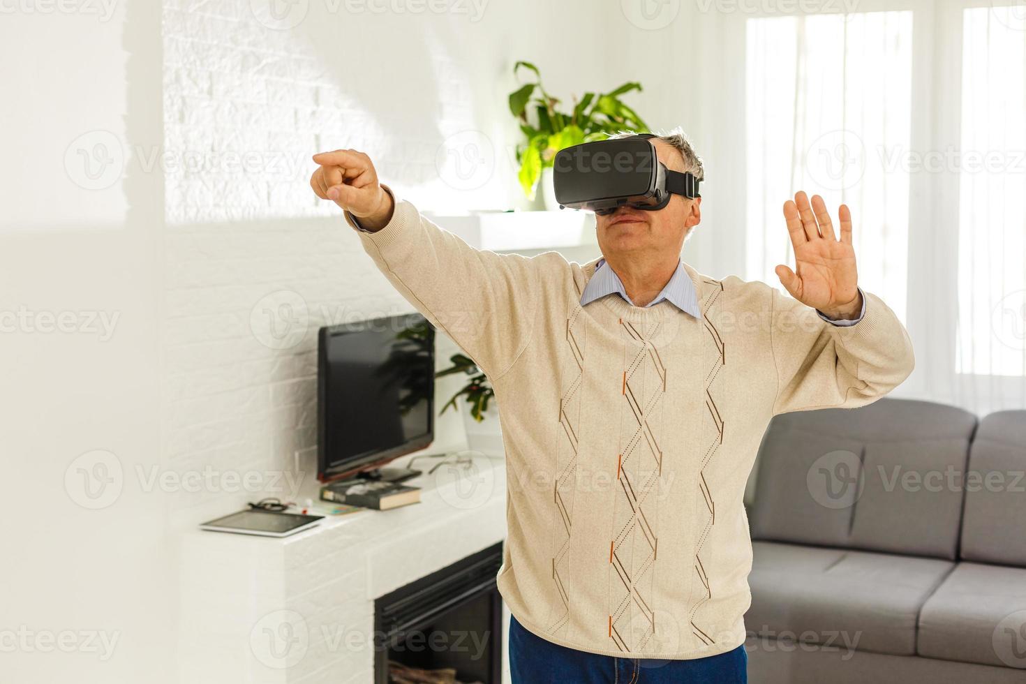 old man with virtual reality goggles photo