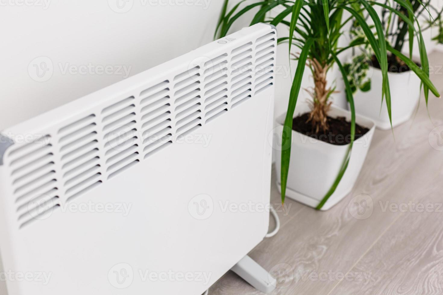 Using heater at home in winter. Heating season. photo