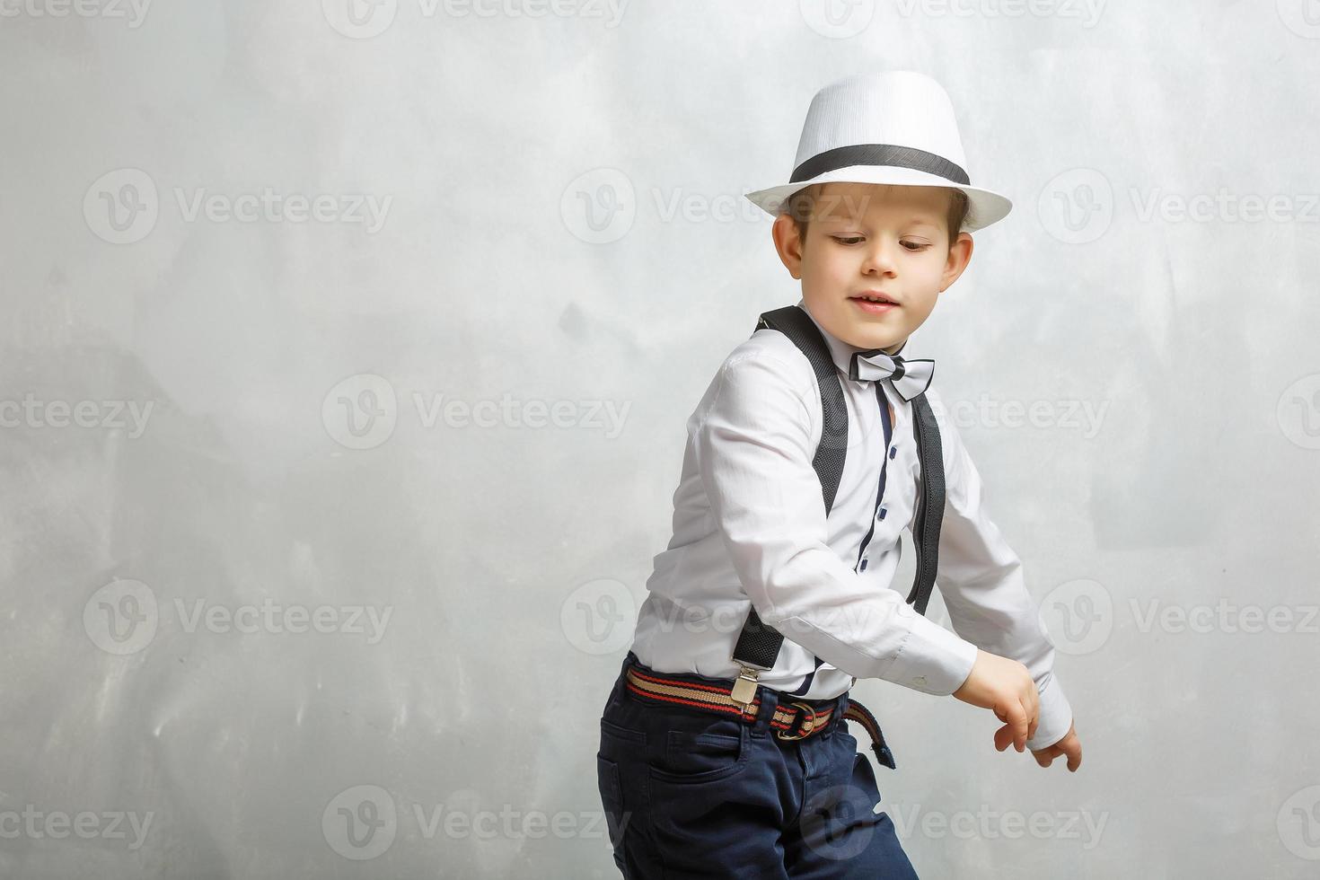 Cute funny boy in dance studio photo